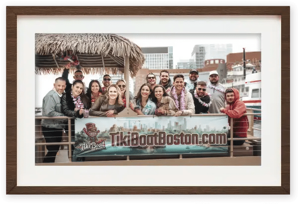 Framed photo of a group on the Tiki Boat Boston
